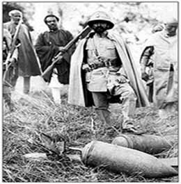 Emperor Haile Selassie is shown stepping on musatred gas bomb